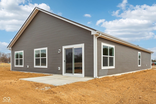 rear view of house featuring a patio