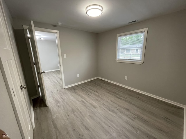 spare room featuring hardwood / wood-style floors