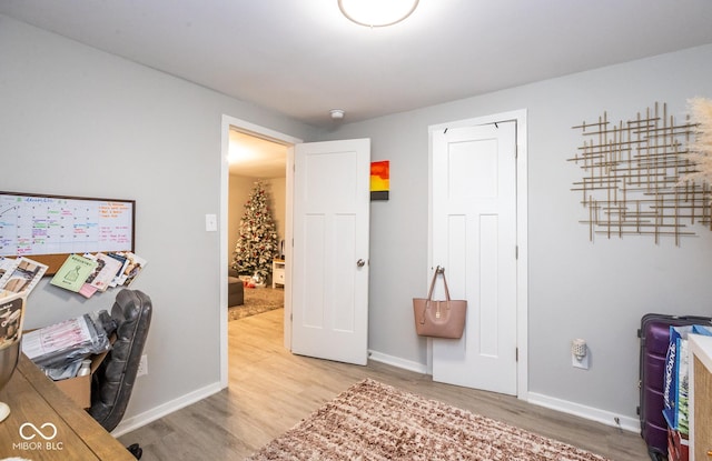 home office with hardwood / wood-style floors