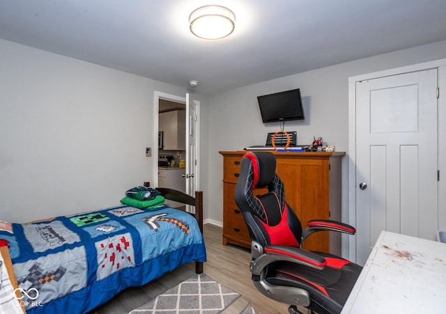 bedroom with light hardwood / wood-style flooring