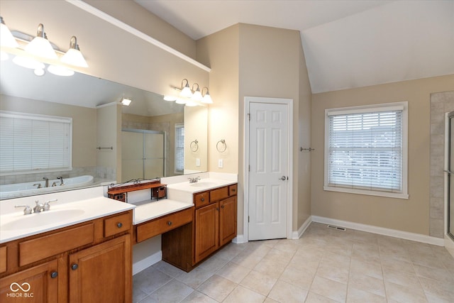 bathroom featuring tile patterned flooring, lofted ceiling, vanity, and independent shower and bath