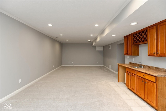 kitchen featuring crown molding and sink