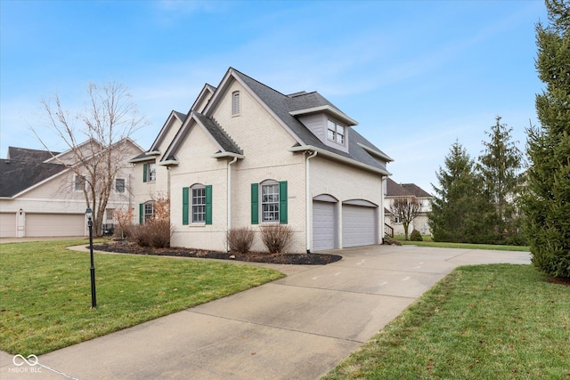 view of front of property featuring a garage and a front yard