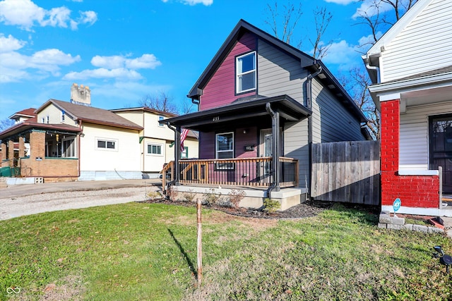 view of front of house with a porch and a front yard