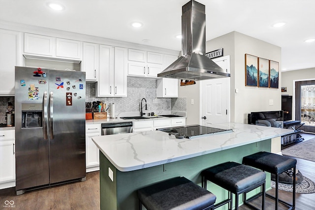 kitchen with white cabinetry, sink, a center island, island exhaust hood, and appliances with stainless steel finishes