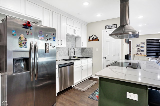 kitchen with white cabinetry, sink, light stone countertops, island exhaust hood, and appliances with stainless steel finishes