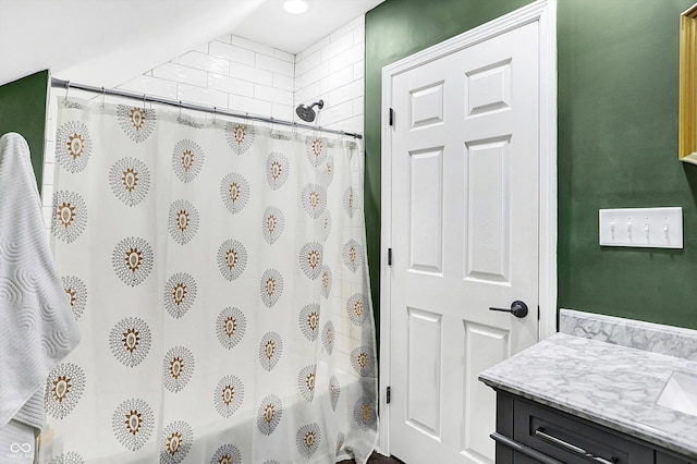 bathroom with vanity and shower / bath combo