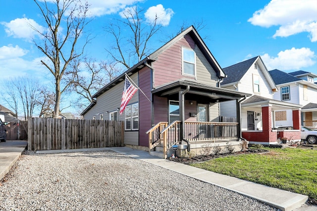 view of front facade featuring a front yard and a porch