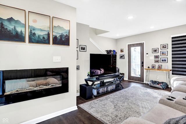 living room with dark hardwood / wood-style floors