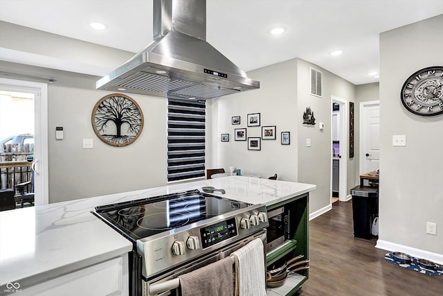 kitchen featuring island exhaust hood, light stone countertops, stainless steel range with electric cooktop, and dark hardwood / wood-style floors