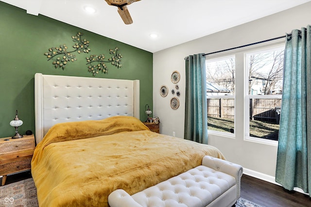 bedroom featuring dark hardwood / wood-style floors and ceiling fan