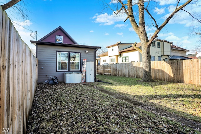 rear view of property with a lawn