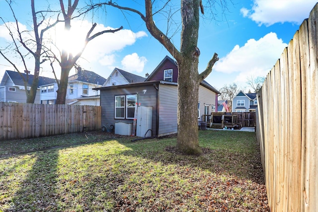 back of house with a yard