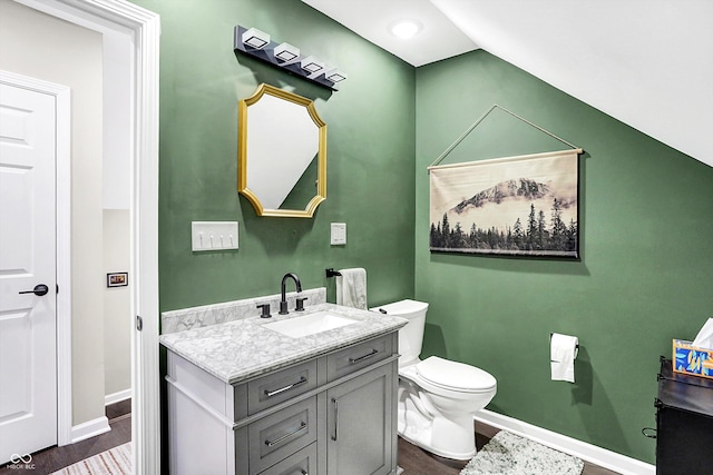 bathroom featuring hardwood / wood-style floors, vanity, and toilet