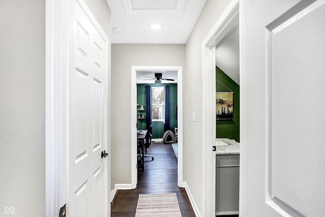 hallway with dark hardwood / wood-style floors