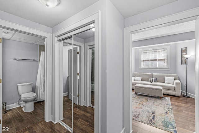 bathroom featuring toilet and hardwood / wood-style flooring