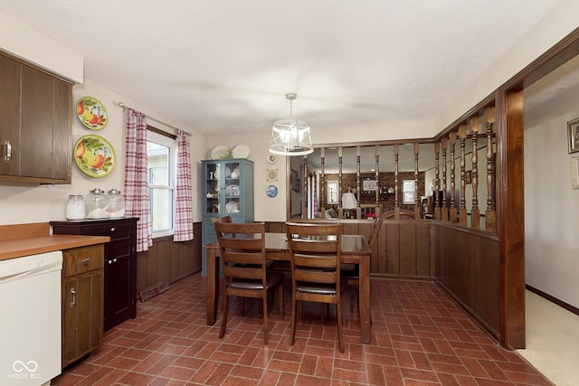 dining space featuring a notable chandelier