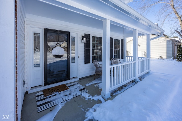 view of snow covered property entrance