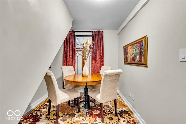 dining area featuring lofted ceiling