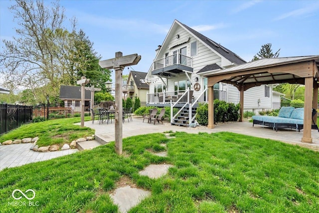 2222 E 75th St, Indianapolis, IN 46240 - rear view of house featuring a gazebo, a patio area, an outdoor living space, and a balcony