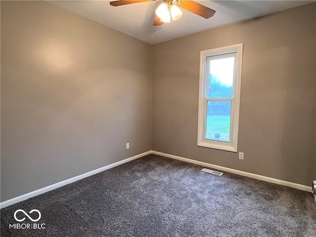 carpeted empty room featuring ceiling fan