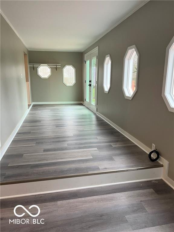 entryway with french doors, plenty of natural light, and hardwood / wood-style floors