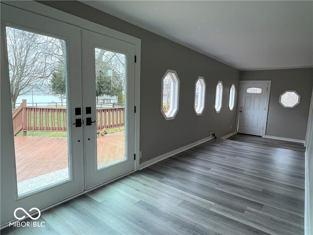 foyer with hardwood / wood-style floors and french doors