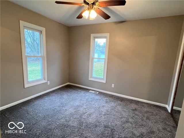 empty room with carpet and ceiling fan