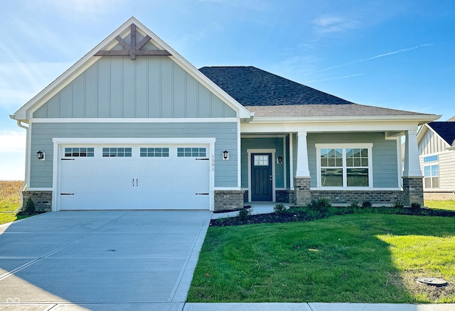 craftsman-style home with a garage and a front lawn