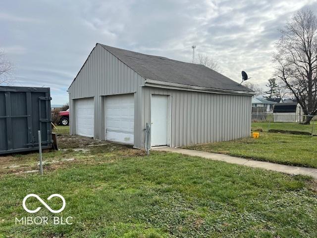 garage featuring a yard