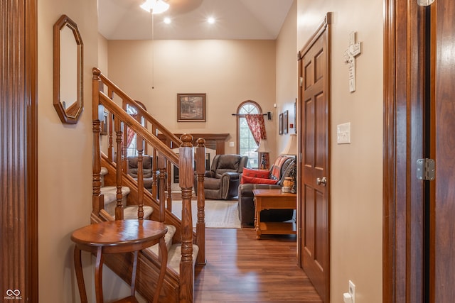 entrance foyer featuring dark hardwood / wood-style floors and vaulted ceiling