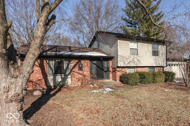 tri-level home with a front yard