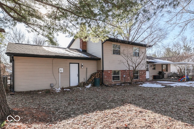 rear view of property with a patio