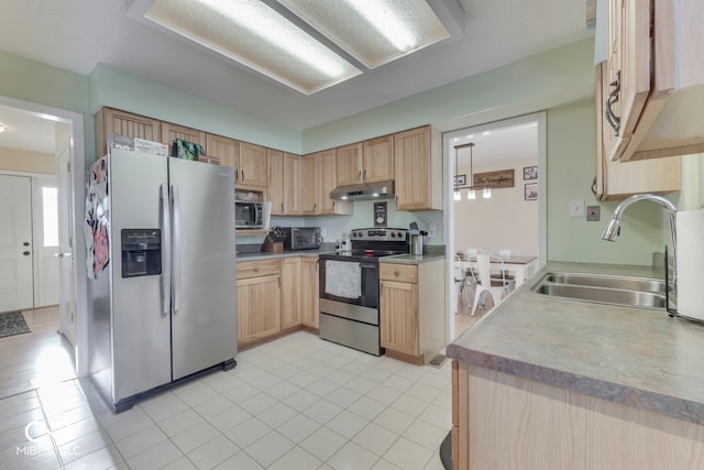 kitchen featuring sink, stainless steel appliances, and light brown cabinets