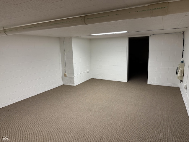 basement with dark colored carpet