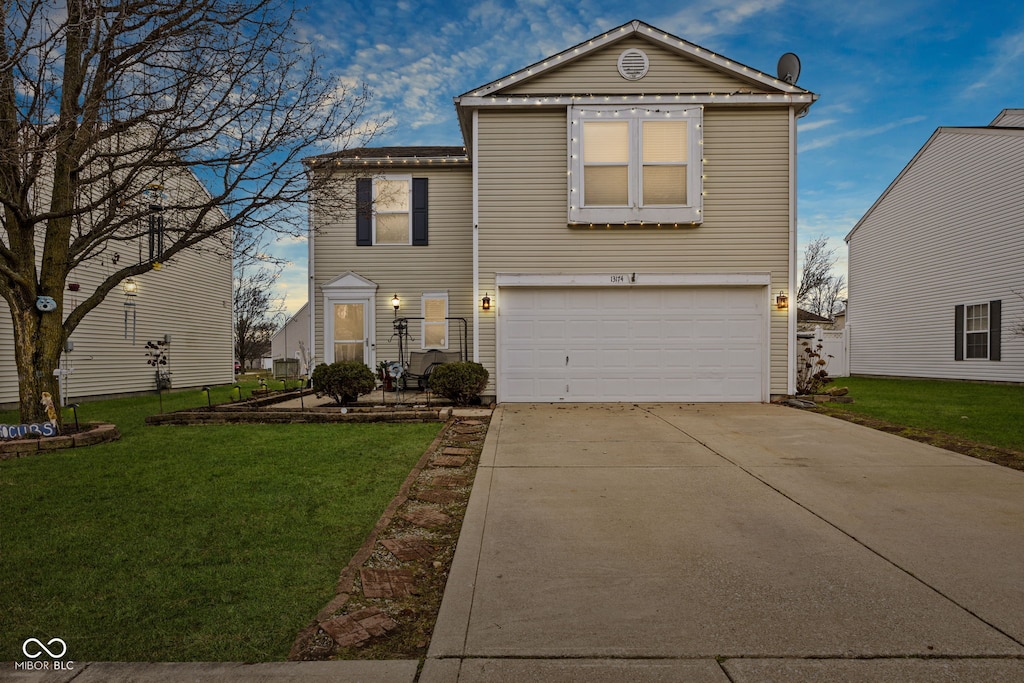 view of front of house featuring a garage and a front yard