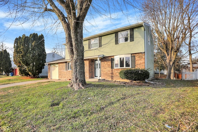 view of front of home featuring a garage and a front lawn