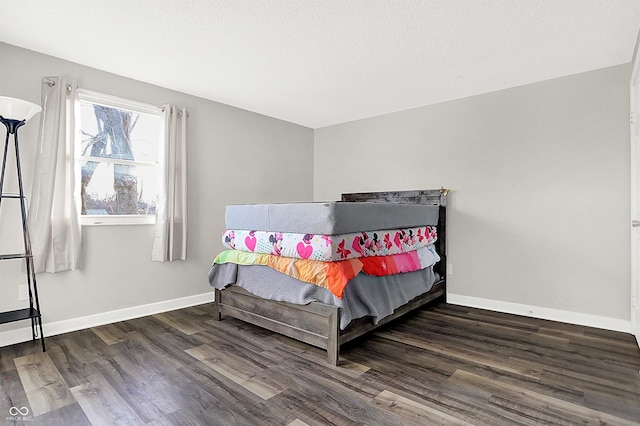 bedroom featuring dark wood-type flooring