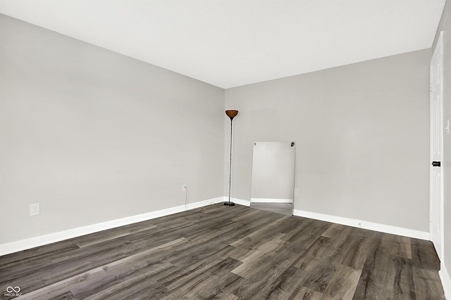 empty room featuring dark hardwood / wood-style floors