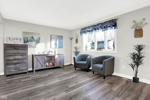 living area with hardwood / wood-style floors