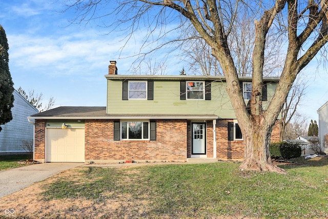 view of property featuring a front yard and a garage