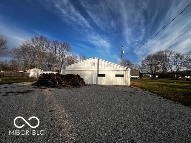 view of side of home with an outbuilding