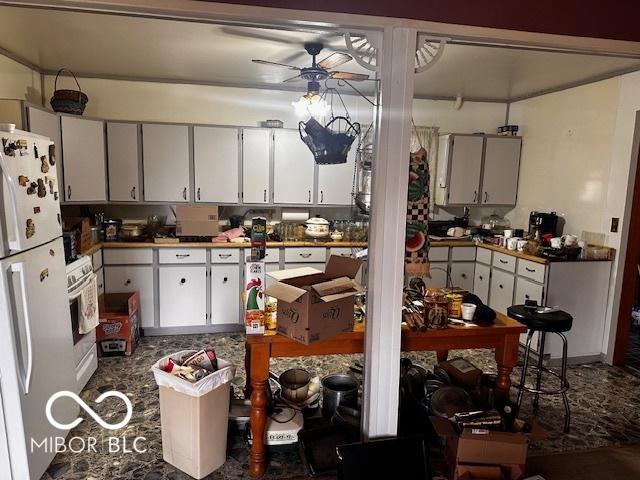 kitchen featuring wall oven, ceiling fan, white cabinets, and white refrigerator