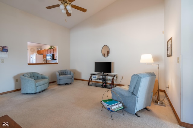 living room with carpet floors, high vaulted ceiling, and ceiling fan