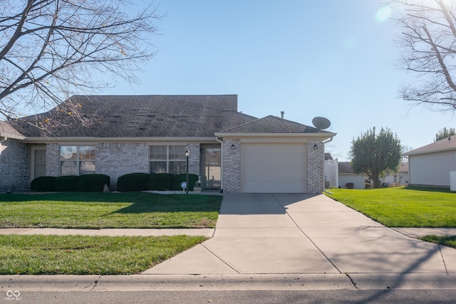 single story home featuring a garage and a front lawn