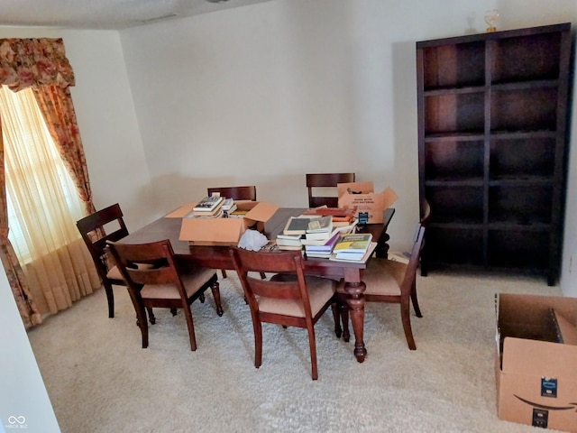 view of carpeted dining space