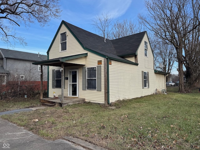 bungalow-style house with covered porch and a front lawn