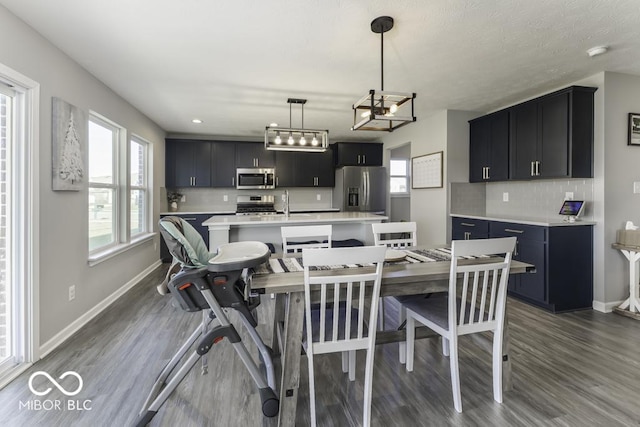 dining space featuring dark wood-type flooring