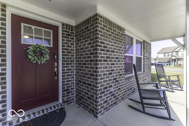 property entrance featuring a porch