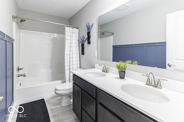 full bathroom with toilet, vanity, and shower / tub combo with curtain